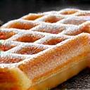 Icoon van een Belgische wafel met poedersuiker